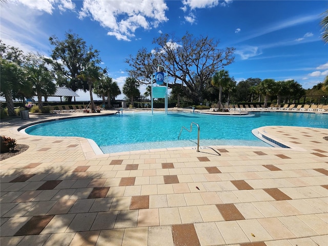 view of swimming pool featuring a patio