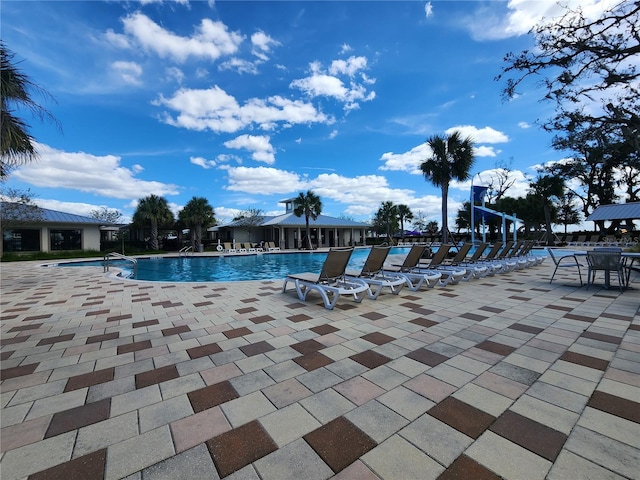 view of swimming pool with a patio