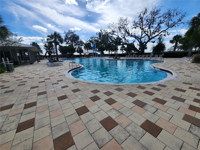 view of swimming pool with a patio area