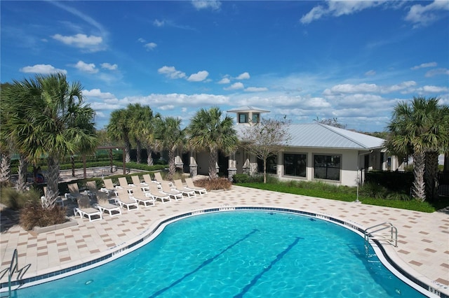 view of pool featuring a patio