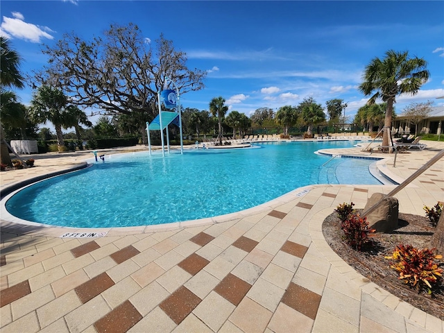 view of swimming pool with a patio