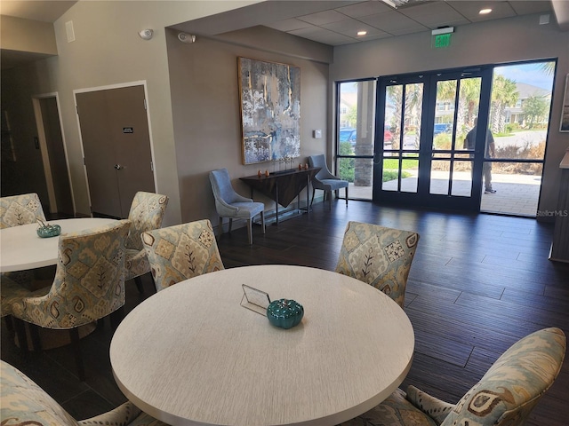 dining area with french doors and dark hardwood / wood-style floors