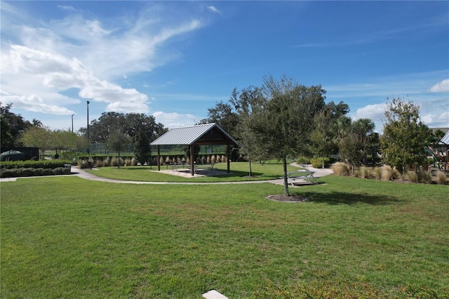 view of community with a lawn and a gazebo