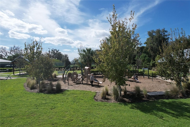 view of community with a playground and a yard