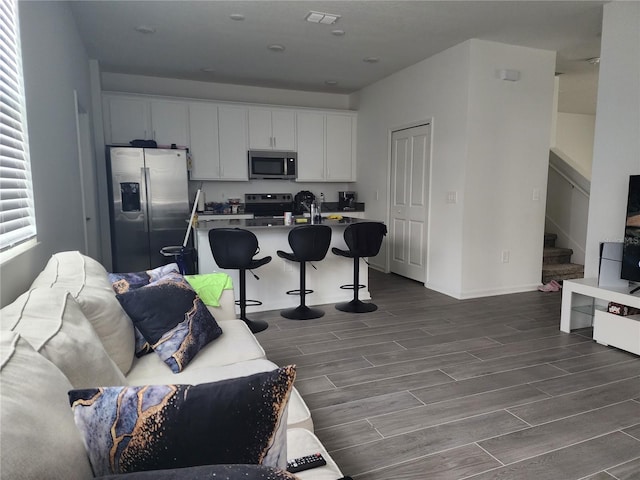 interior space featuring sink and dark hardwood / wood-style flooring