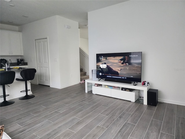 living room with wood-type flooring and built in desk