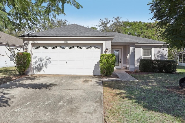 ranch-style house with a front lawn and a garage