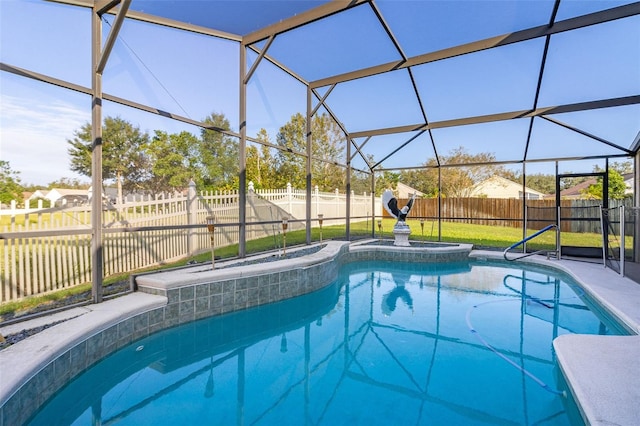 view of pool with glass enclosure