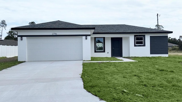 single story home with a front lawn and a garage