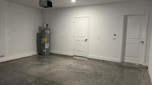 garage featuring a garage door opener and electric water heater