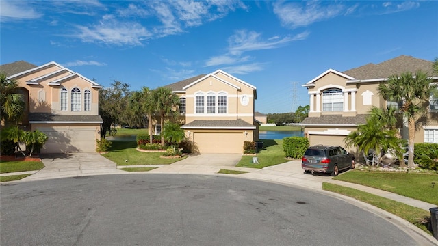 view of front of house featuring a garage and a front lawn