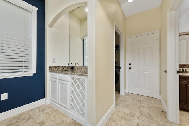 bathroom with vanity and tile patterned floors