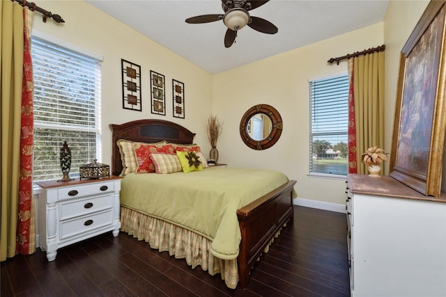 bedroom with dark wood-type flooring and ceiling fan