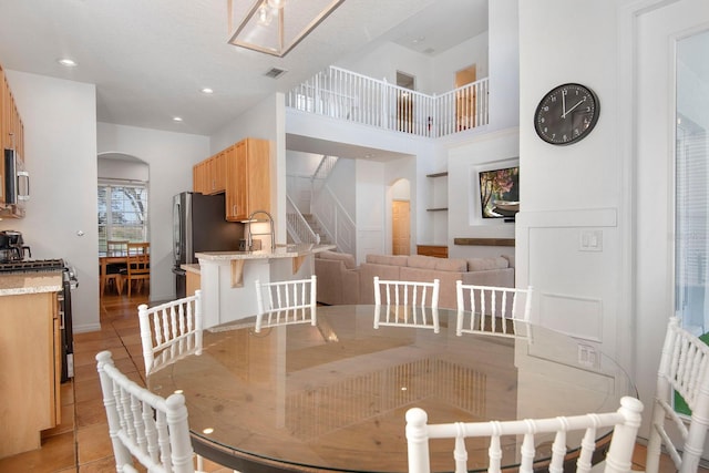 dining area with light tile patterned floors