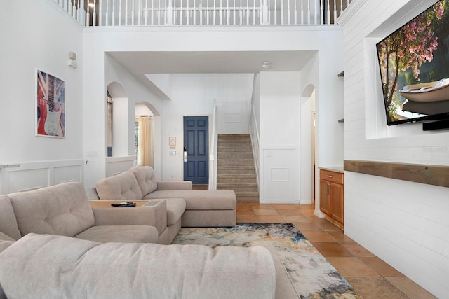 living room featuring a high ceiling