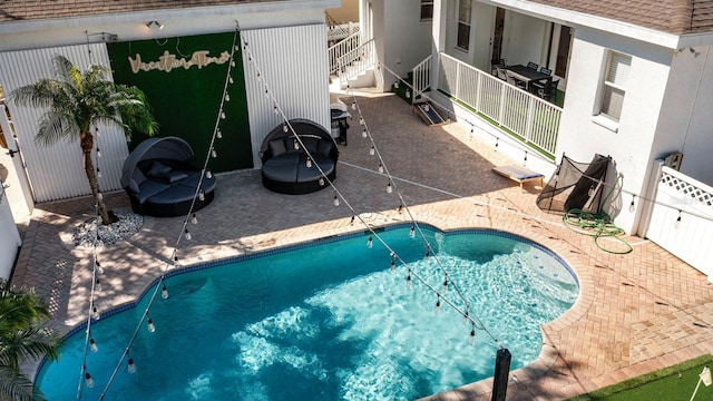 view of swimming pool with a patio