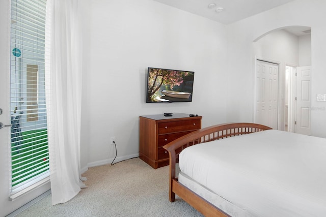 carpeted bedroom featuring a closet