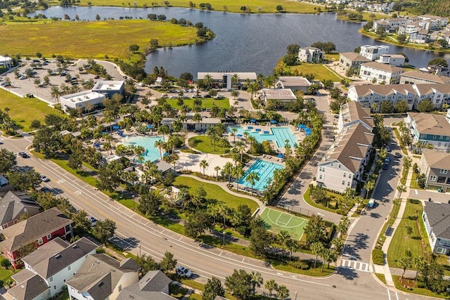 birds eye view of property with a water view