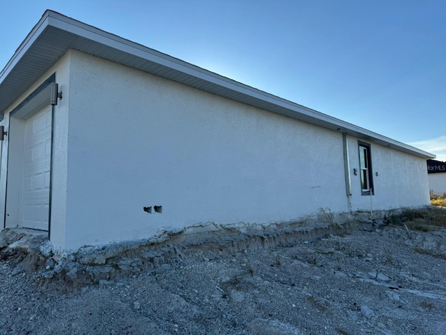 view of property exterior with a garage