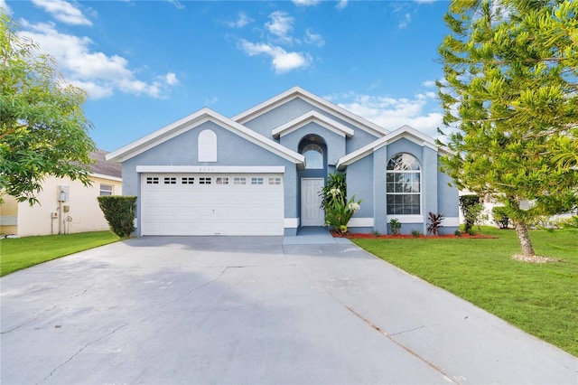 ranch-style home with a front lawn and a garage