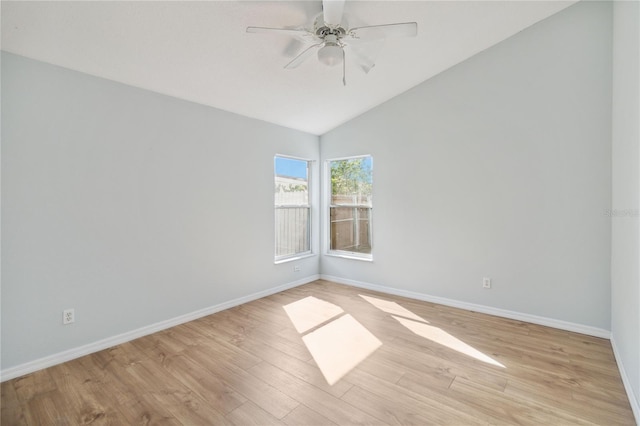 spare room with lofted ceiling, light hardwood / wood-style flooring, and ceiling fan