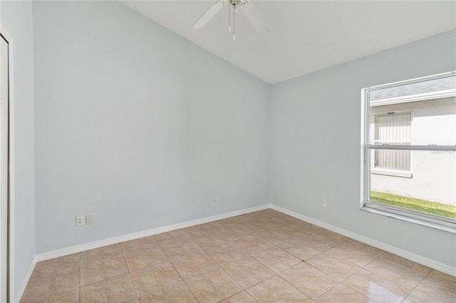 spare room with light tile patterned floors and ceiling fan