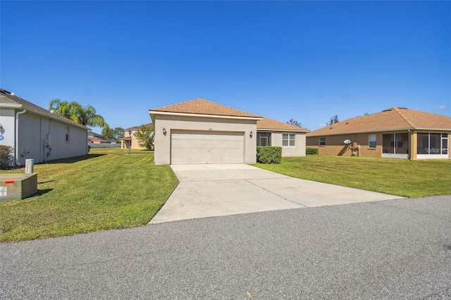 single story home featuring a front lawn and a garage