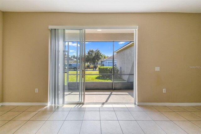 tiled empty room with baseboards