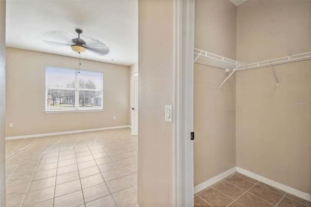 interior space with ceiling fan and light tile patterned floors