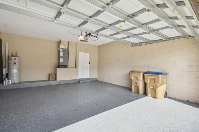 garage with concrete block wall, heating unit, water heater, and a garage door opener