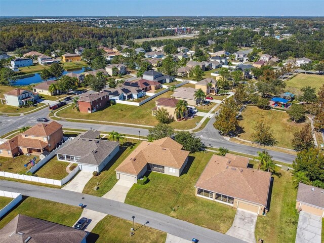 bird's eye view with a water view and a residential view