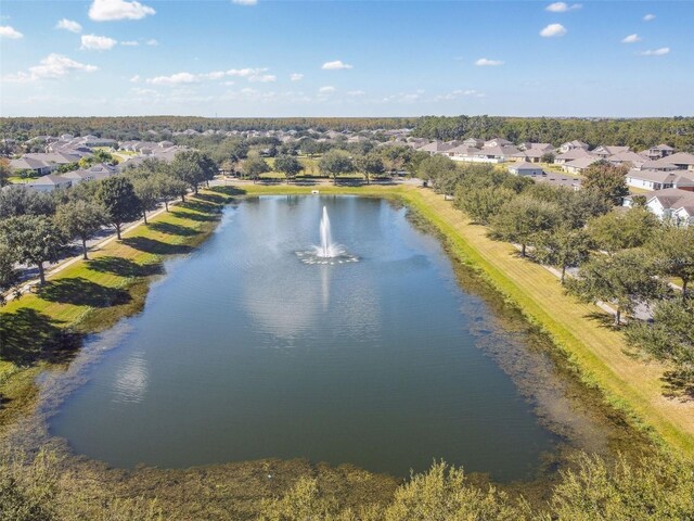 drone / aerial view with a water view and a residential view