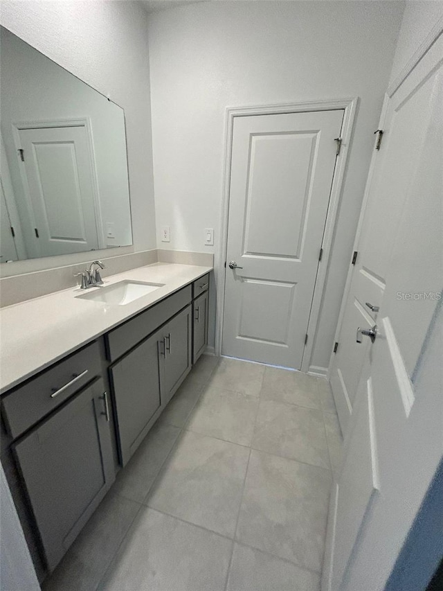 bathroom featuring vanity and tile patterned flooring