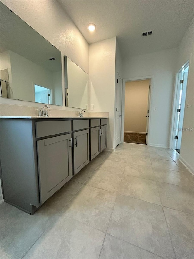 bathroom featuring vanity and a textured ceiling