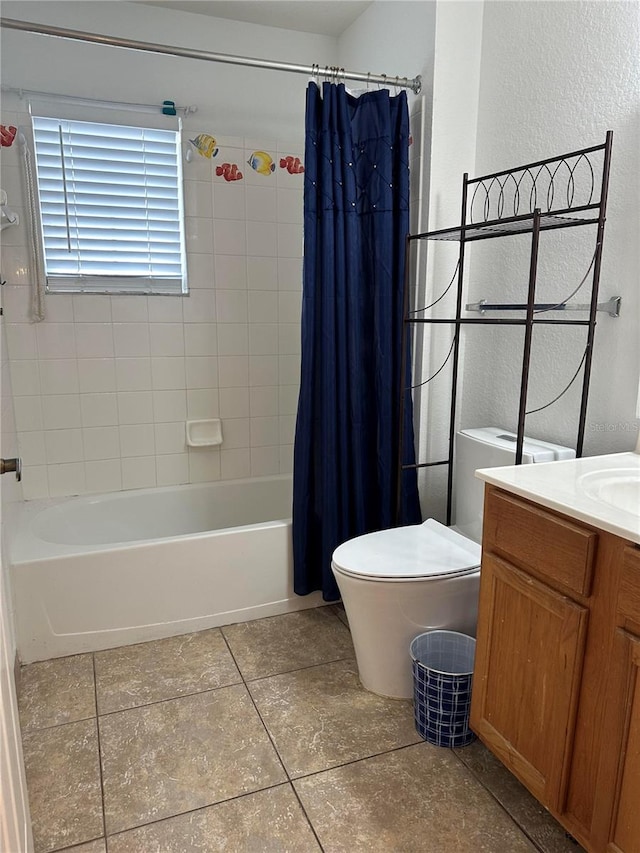 full bathroom featuring vanity, toilet, tile patterned flooring, and shower / tub combo with curtain