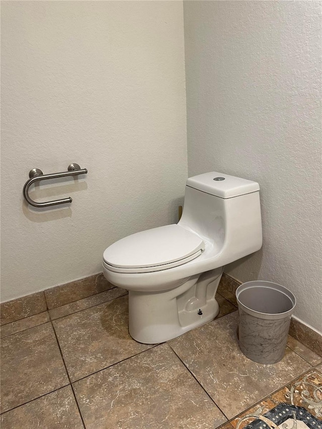 bathroom featuring tile patterned floors and toilet