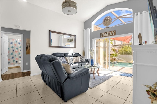 tiled living room featuring vaulted ceiling