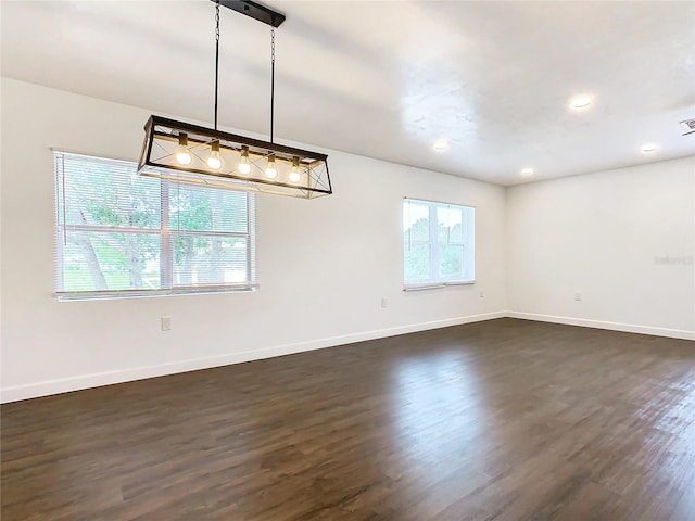 unfurnished room featuring dark hardwood / wood-style floors