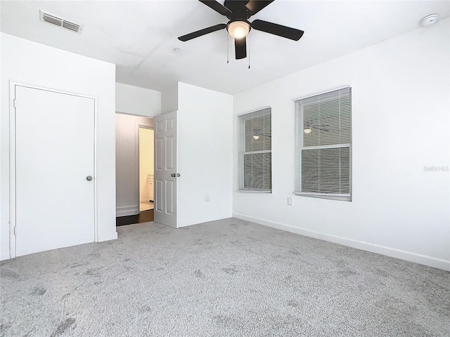 unfurnished bedroom featuring ceiling fan and carpet floors