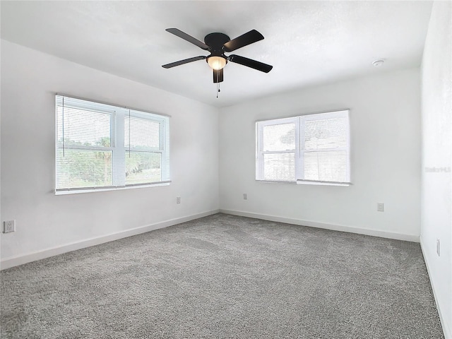 carpeted empty room with ceiling fan