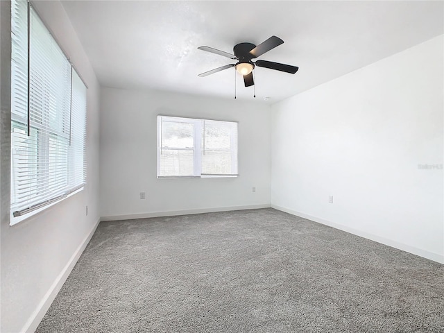 unfurnished room with carpet flooring and ceiling fan