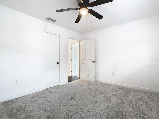 unfurnished room with carpet flooring and ceiling fan