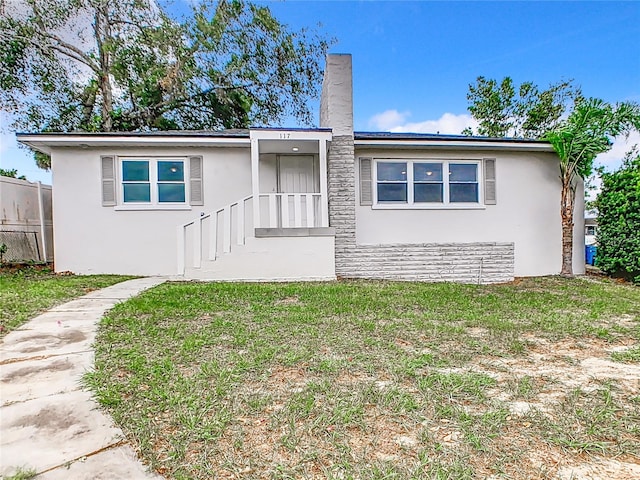 view of front of house with a front lawn