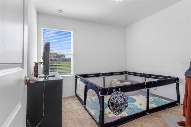 carpeted bedroom with a textured ceiling