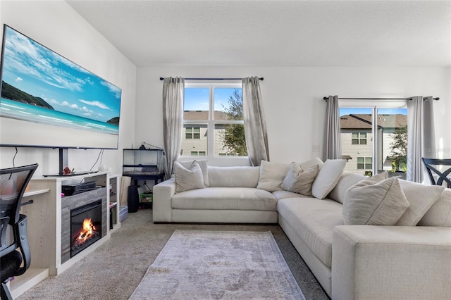 living room with light carpet and a textured ceiling