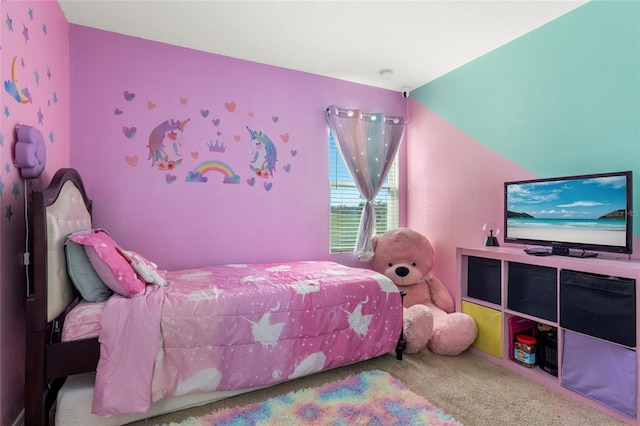 carpeted bedroom featuring lofted ceiling