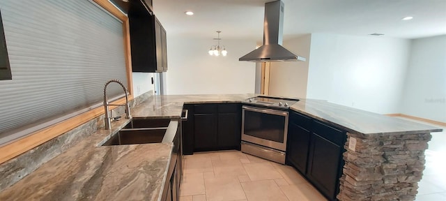 kitchen with a chandelier, island range hood, sink, stainless steel range with electric stovetop, and decorative light fixtures