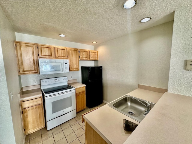 kitchen featuring white appliances, sink, a textured ceiling, and light tile patterned floors