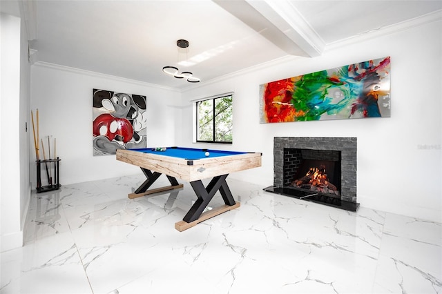 recreation room with marble finish floor, a lit fireplace, ornamental molding, and billiards