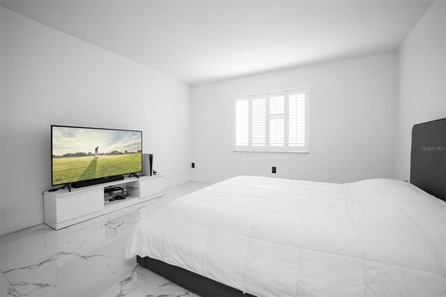 bedroom with marble finish floor